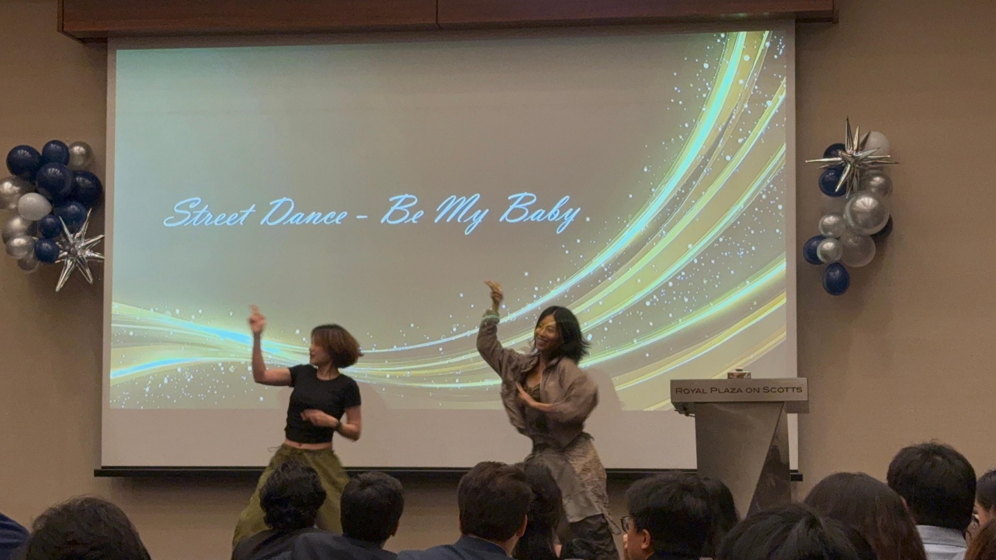 Sheng Jie performing a street dance item at an MScPHM cohort celebration