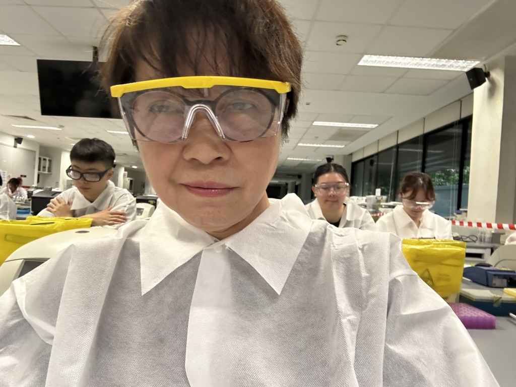 Dr Chong Yoke Sin taking part in a hands-on laboratory practical during the MScPHM programme