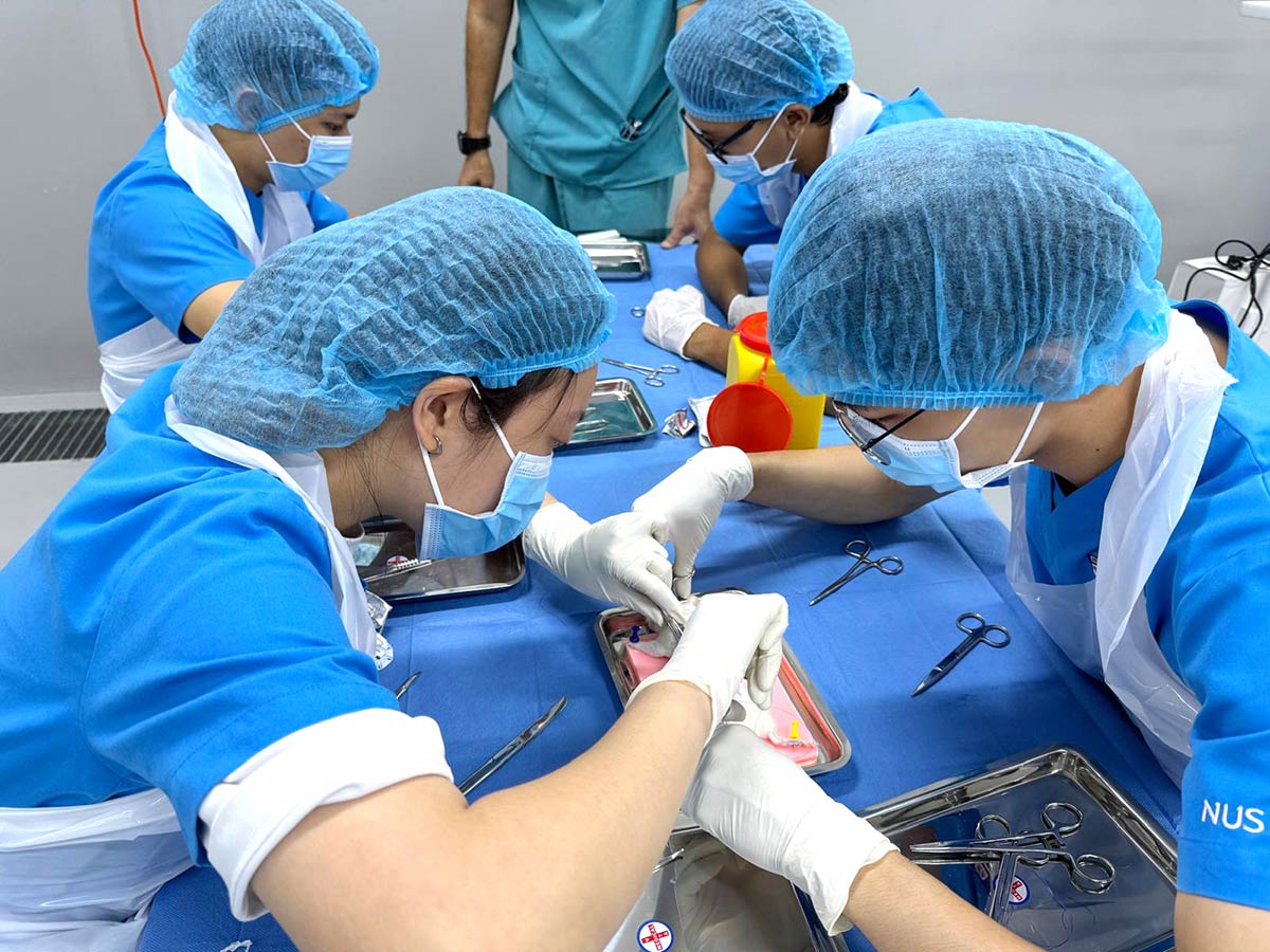 Learning basic suturing techniques on a silica gel training model first!