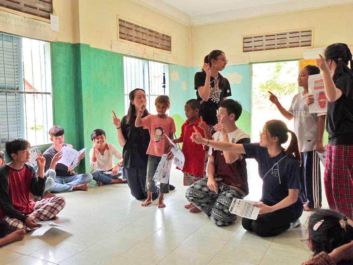 Sharing hygiene knowledge with children at the orphanage through play.