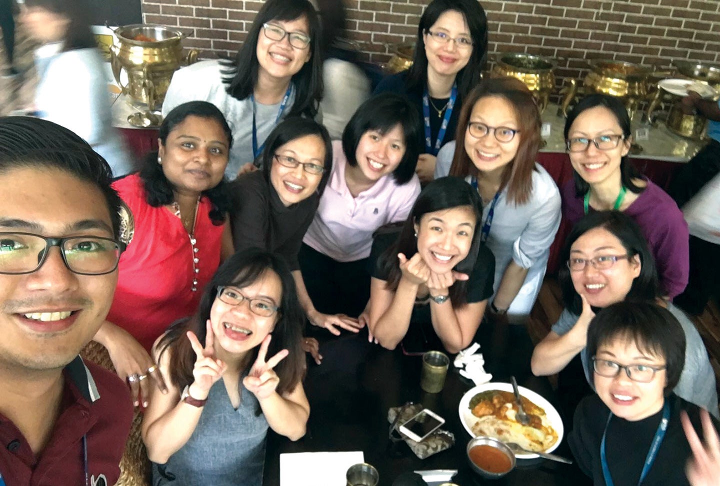 Dr Jiang (third row, first from right) enjoying a casual meal out with NUS Nursing colleagues.