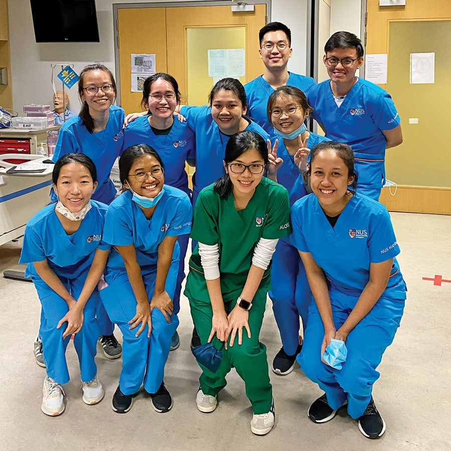 Dr Chua with nurses near doors