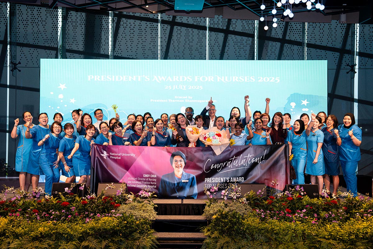 Cindy Chua - Banner reads Congratulations Presidents Award at NUHS Singapore.