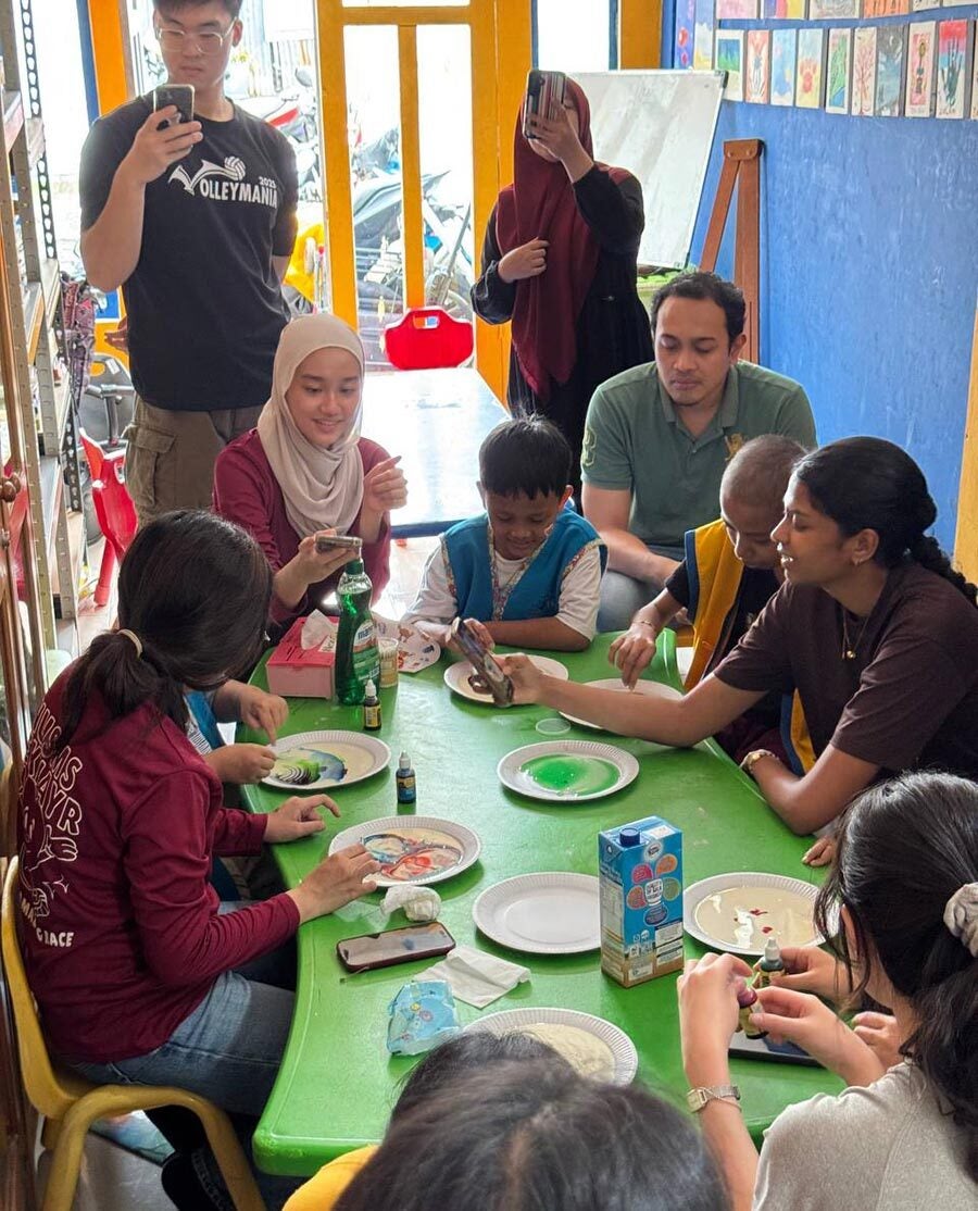 LCIP volunteers at work with children, at RSUP Hasanuddin Hospital.