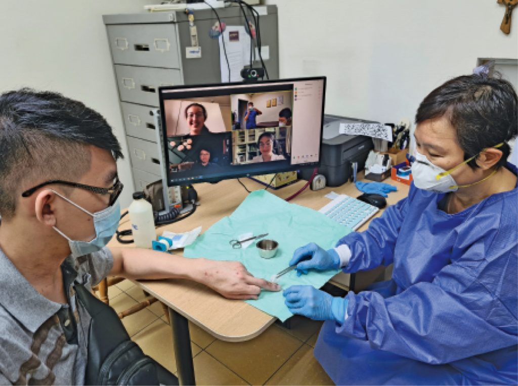 Medical students observed through Zoom the proceedings in a clinic as Dr Angela Lim dressed a patient’s wound.