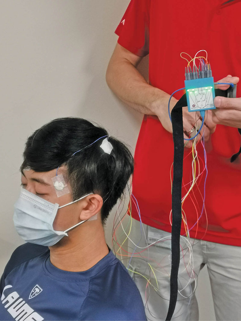 Insert image - Student connected to sleep study module