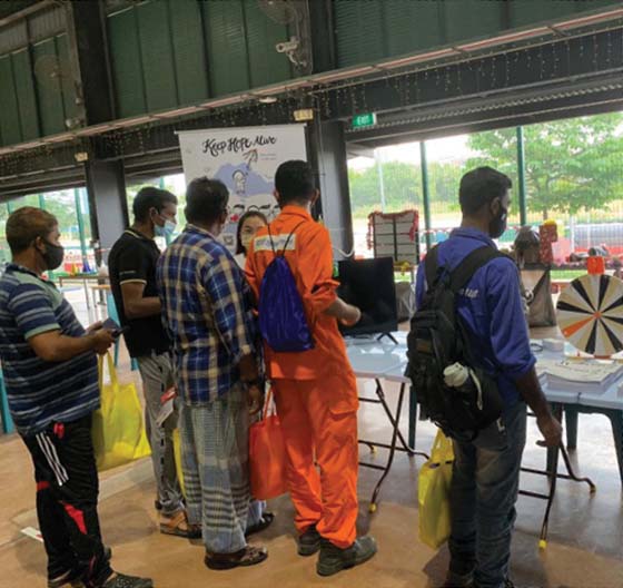 Photo of migrant workers at Penjuru Recreation Centre.