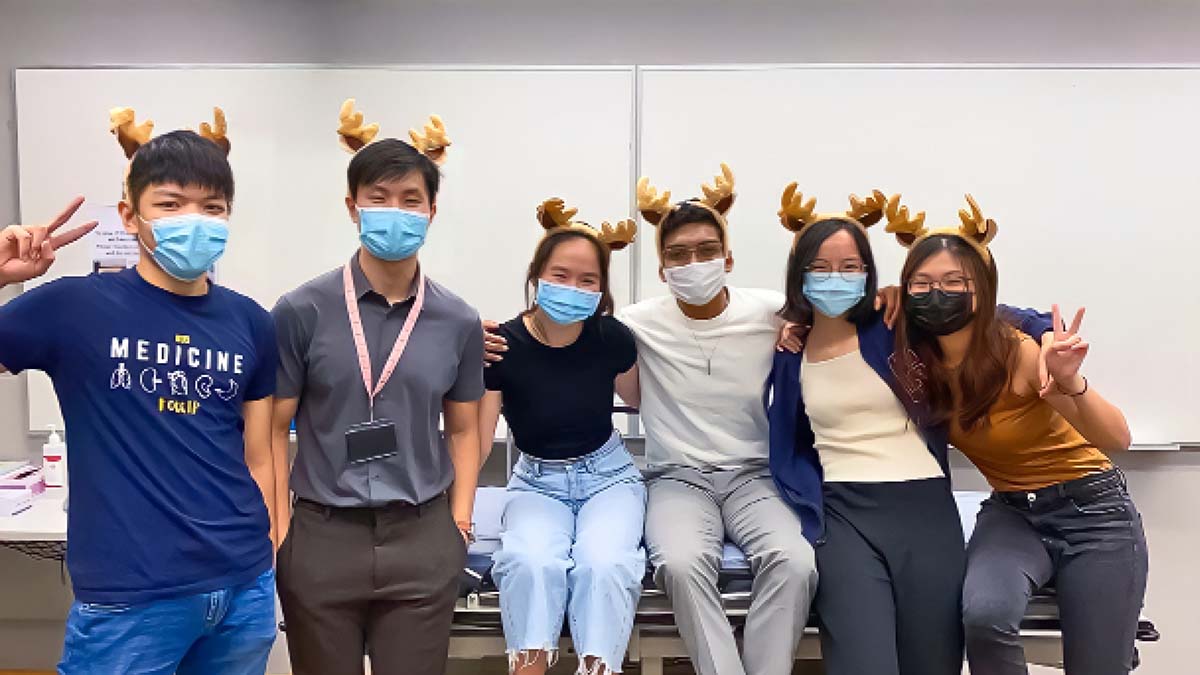 Photo of medical students of Dr Hussain wearing reindeer antlers
