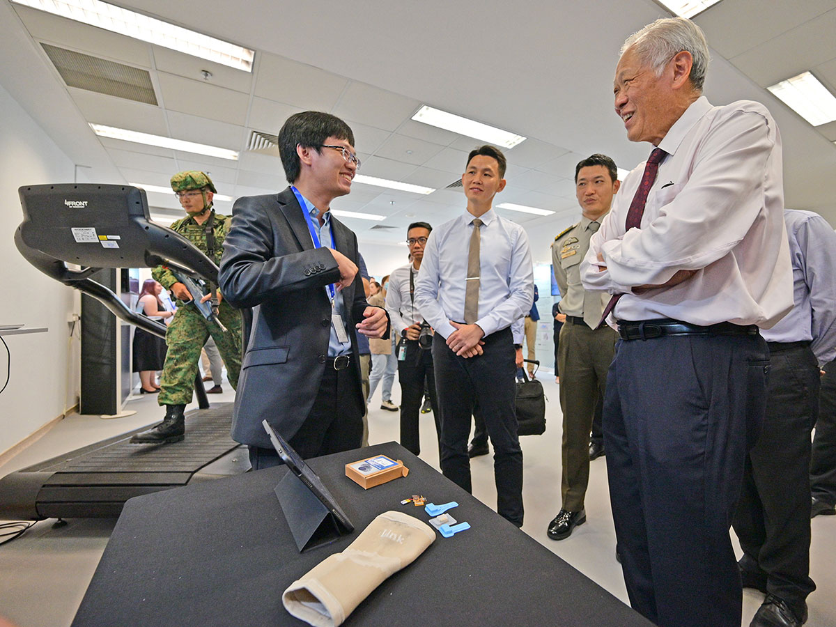Minister for Defence Dr Ng Eng Hen listening to a presentation on wireless body sensor networks