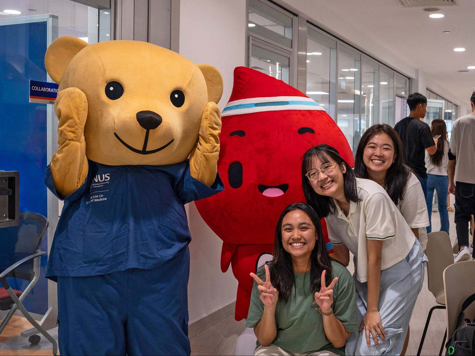 Photo of NUS MediCine mascots and UHF2024 participants.