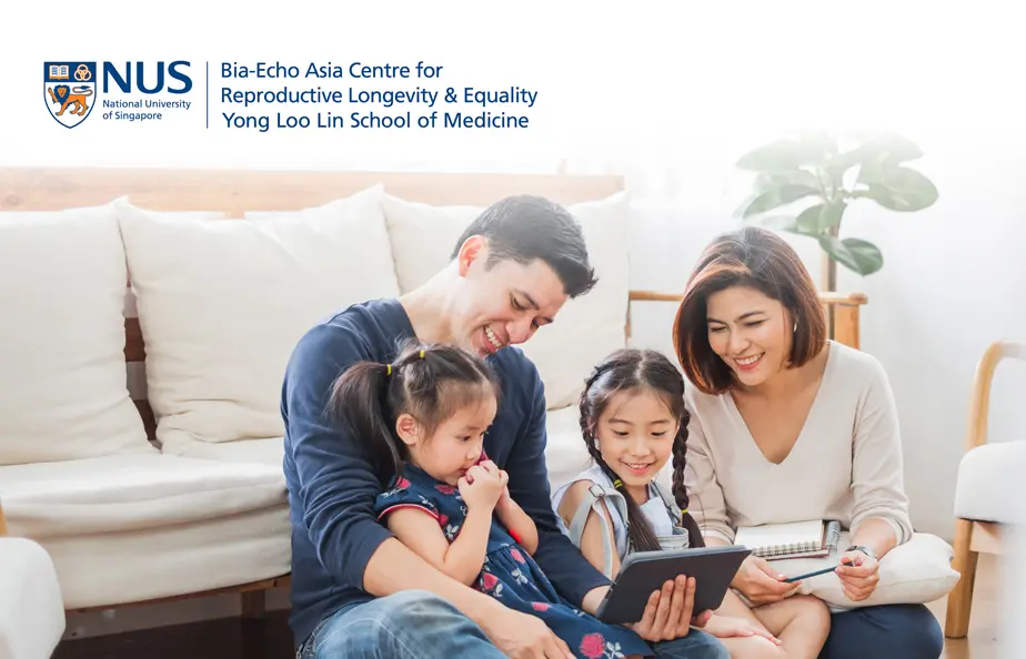 An Asian family with two parents and two children in a home setting to represent the Bia-Echo Asia Centre for Reproductive Longevity and Equality ACRLE