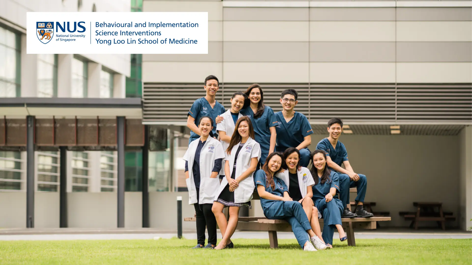 A group of NUS Medicine students gathered together in a casual outdoor setting to represent the Centre for Behavioural and Implementation Science Interventions, BISI