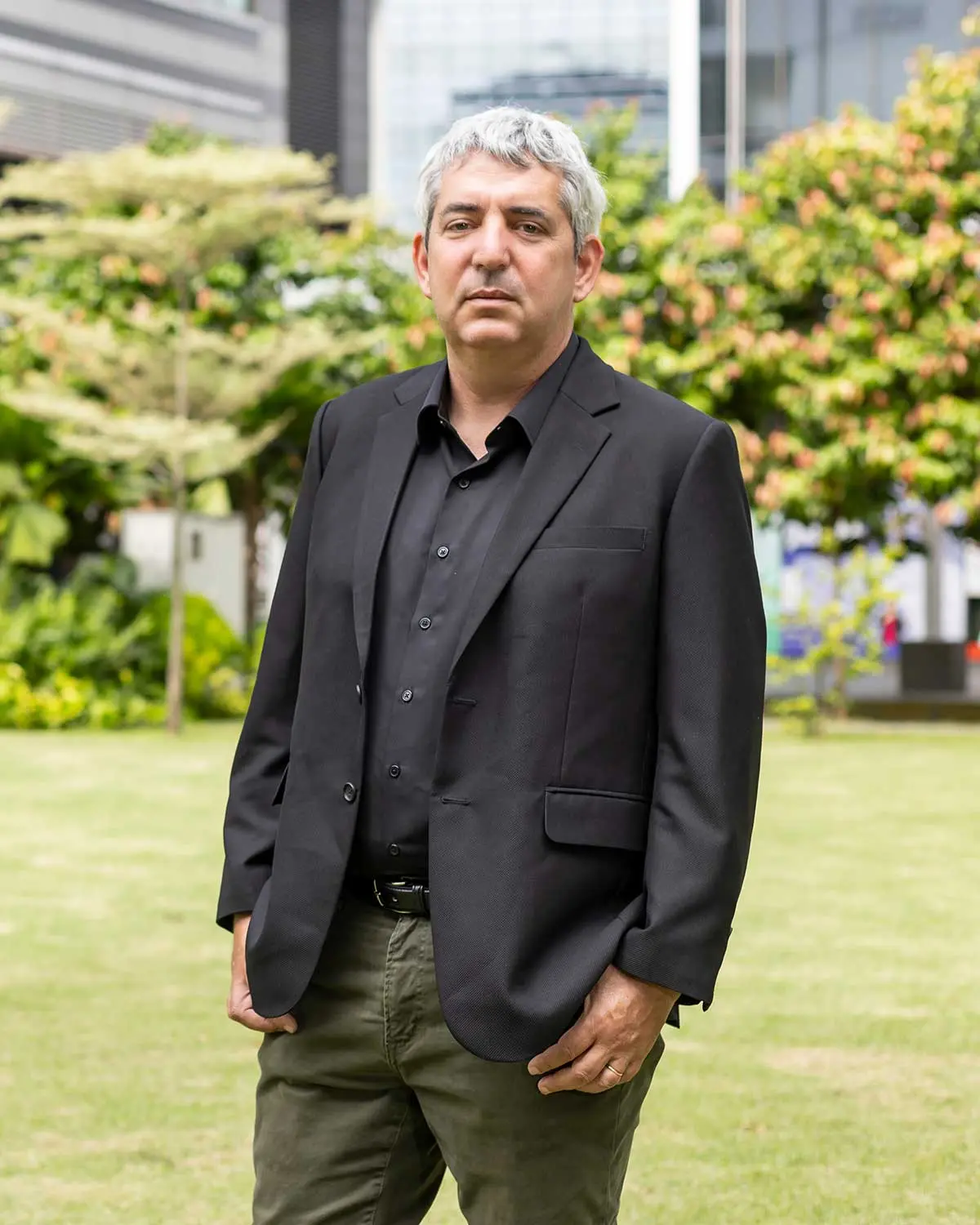 Photo of Professor Uri Gneezy standing on grass area outside University of California, San Diego