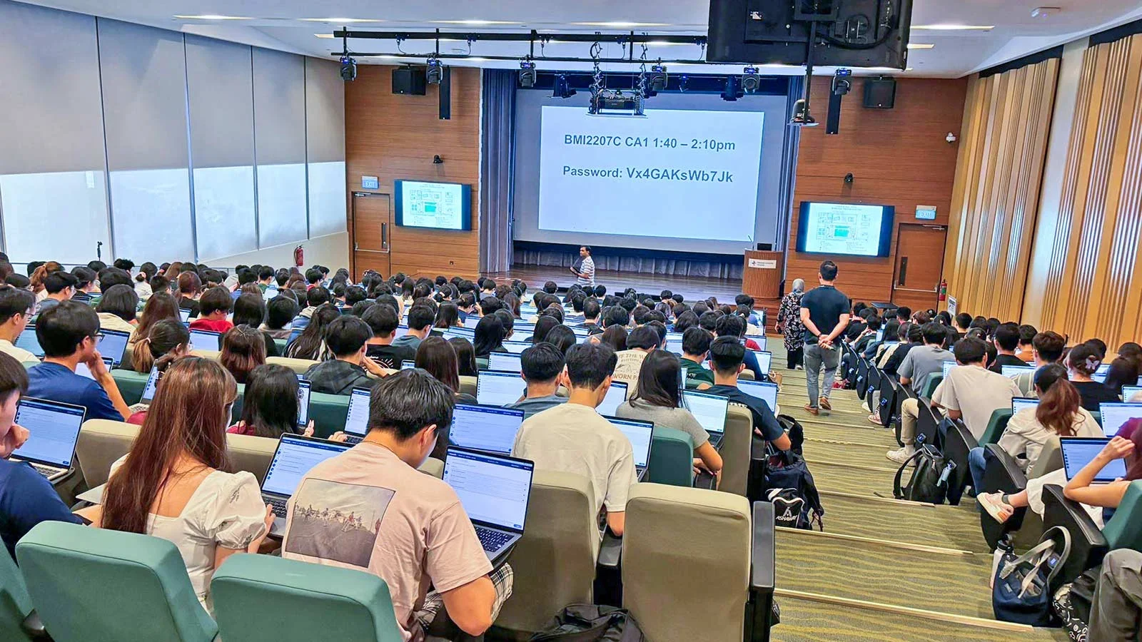 Lecture hall, view from back of hall slightly tilted down.