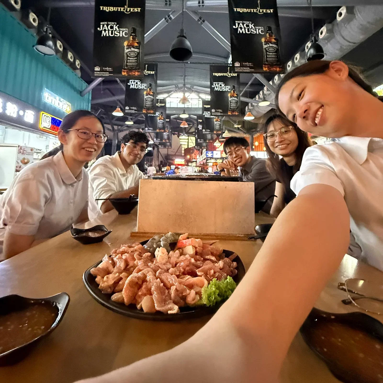 Yuechen (fourth from left) having lunch with her CG mates at Ghim Moh Road Food Centre.