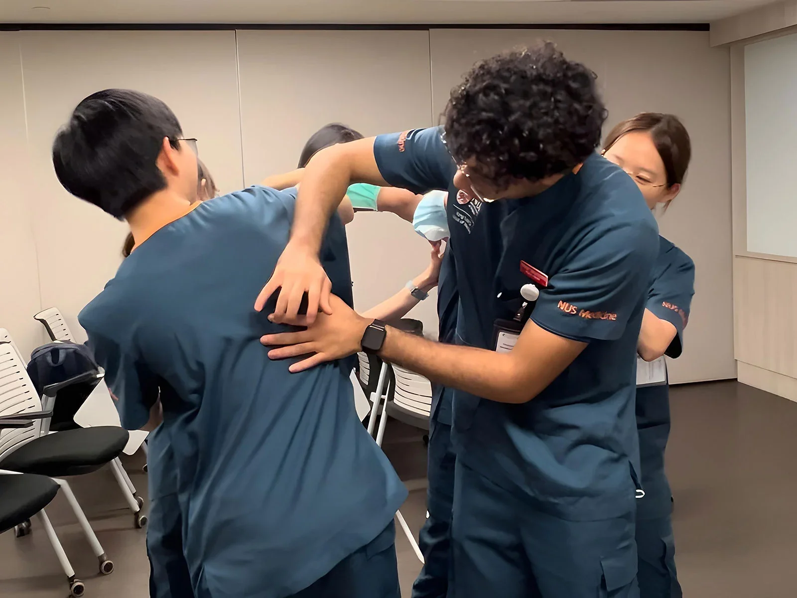 Yufan practising percussion with her clinical group mates.