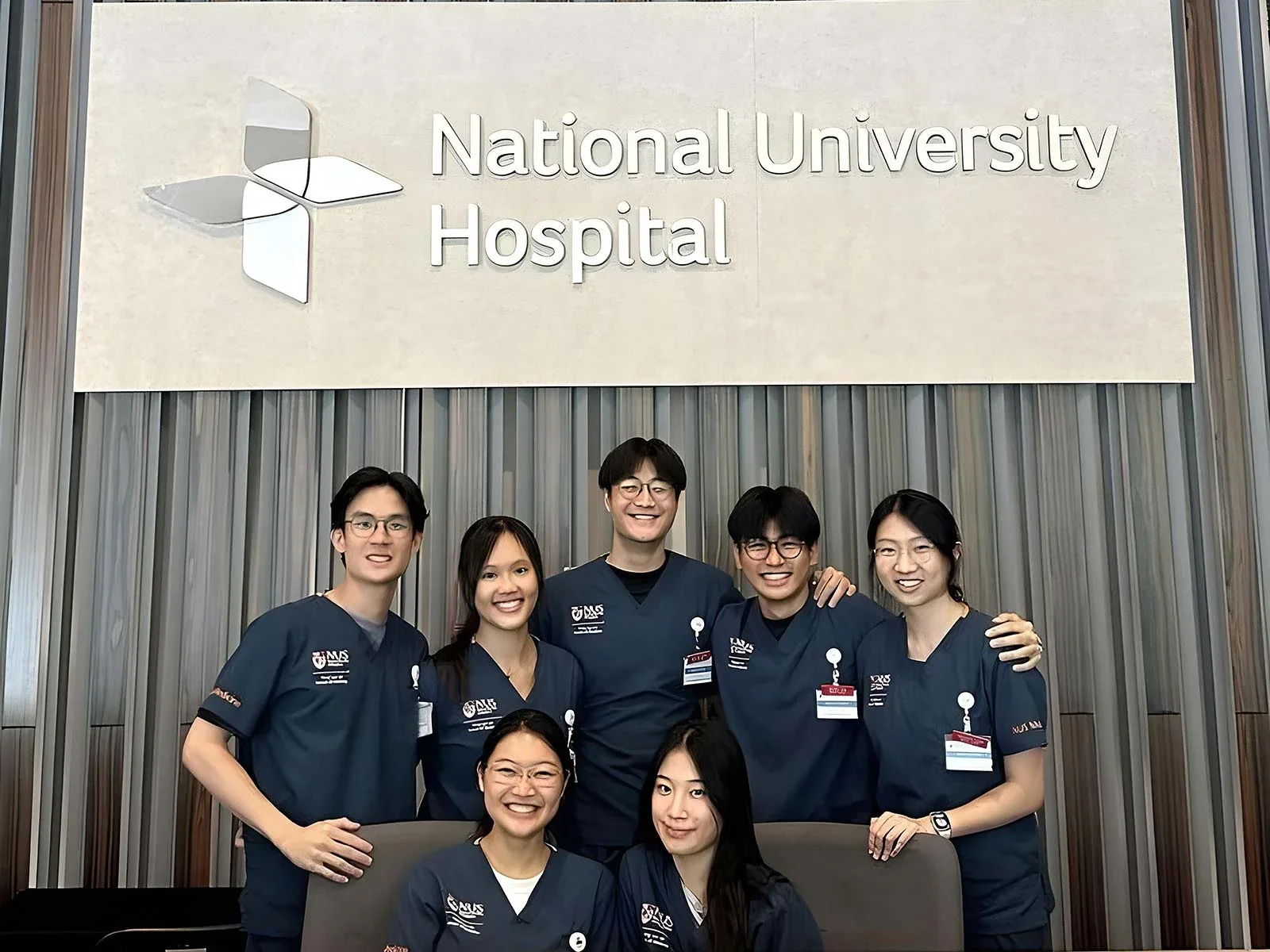 Yuechen (back row, right) wrapping up IM posting at NUH.