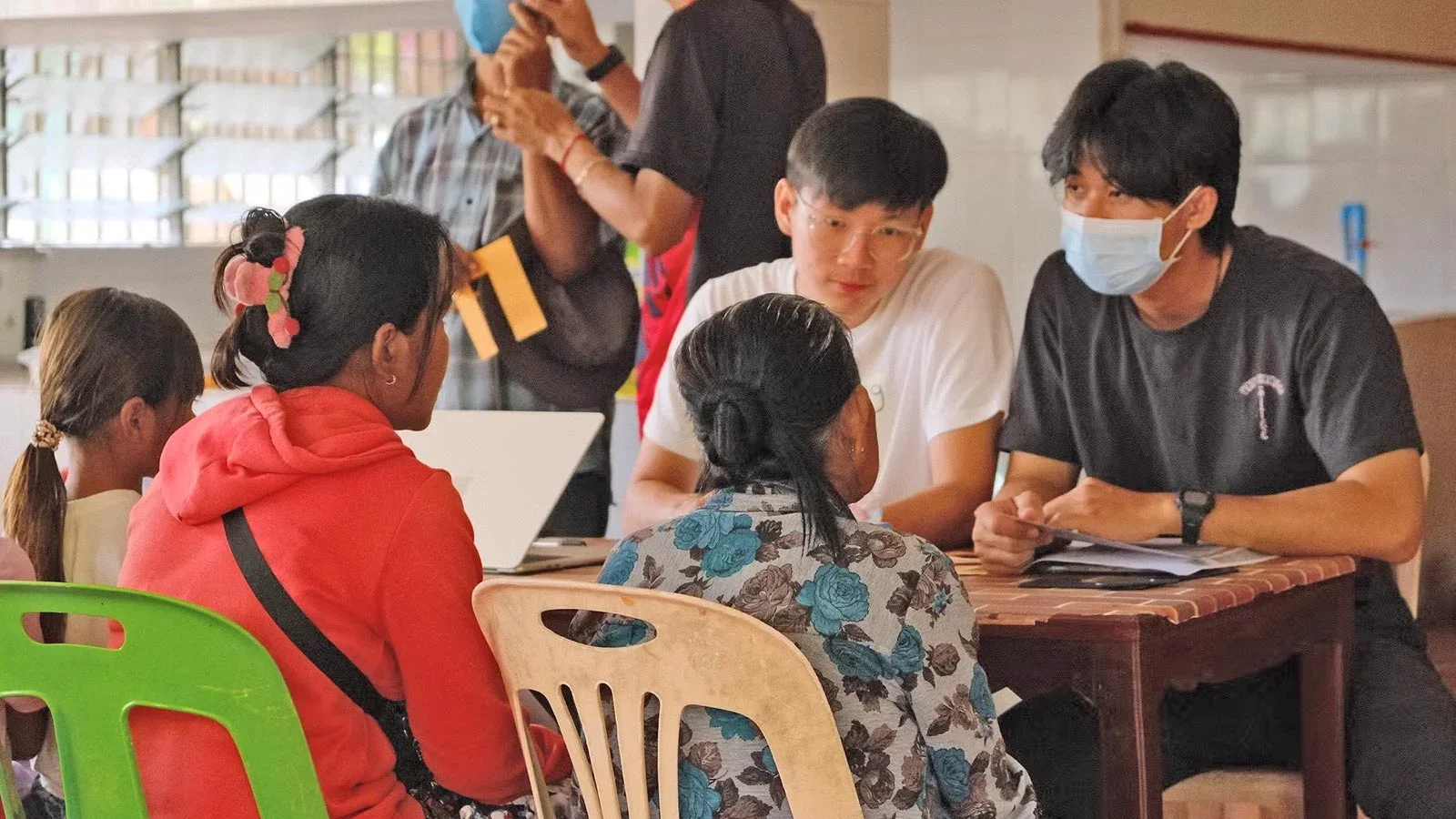 Students from Project Battambang triaging the villagers together with Cambodian volunteers.