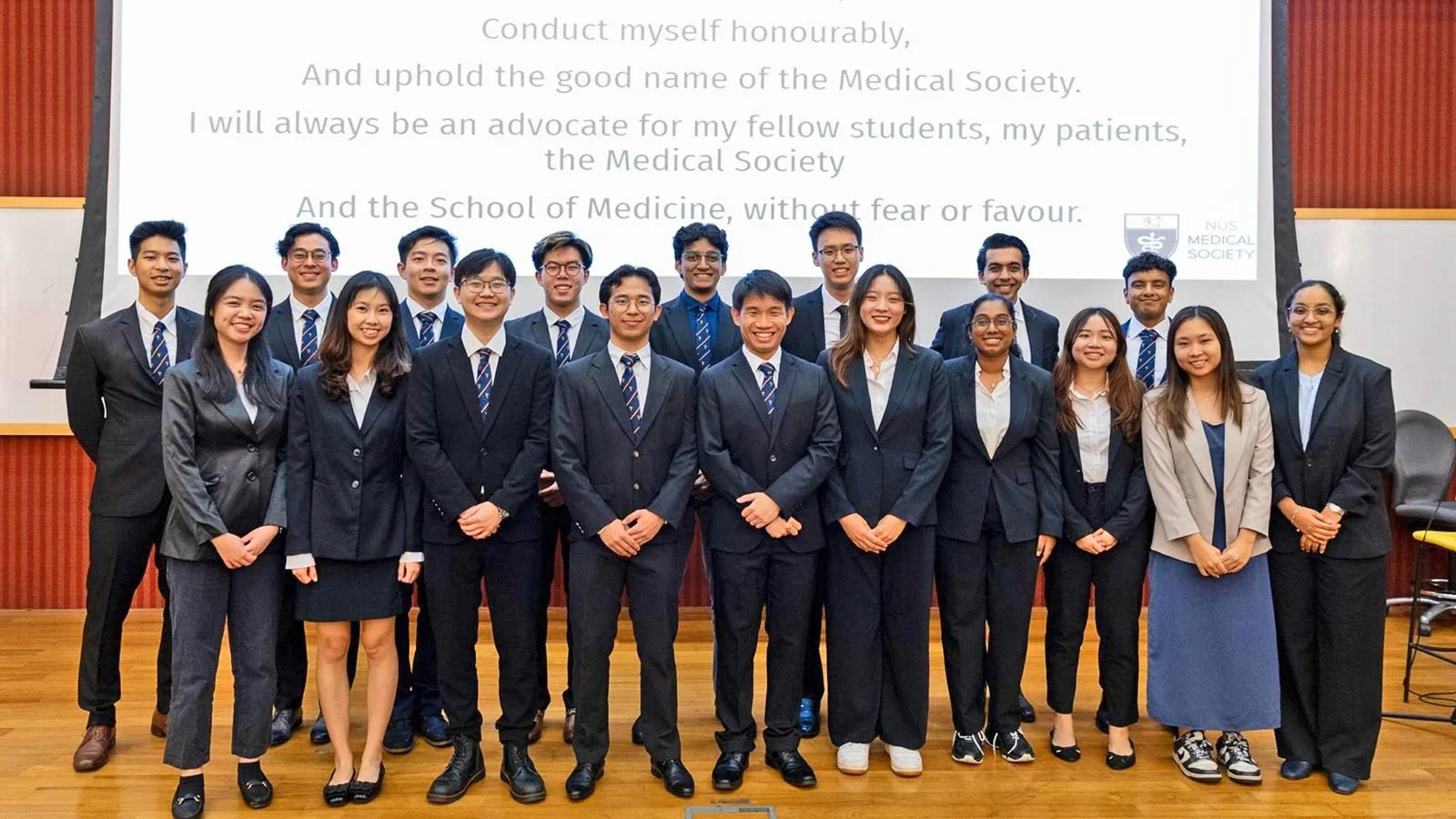Aravind (back row, right) is swearing in at the 76th MedSoc Annual General Meeting with other Executive Committee members.