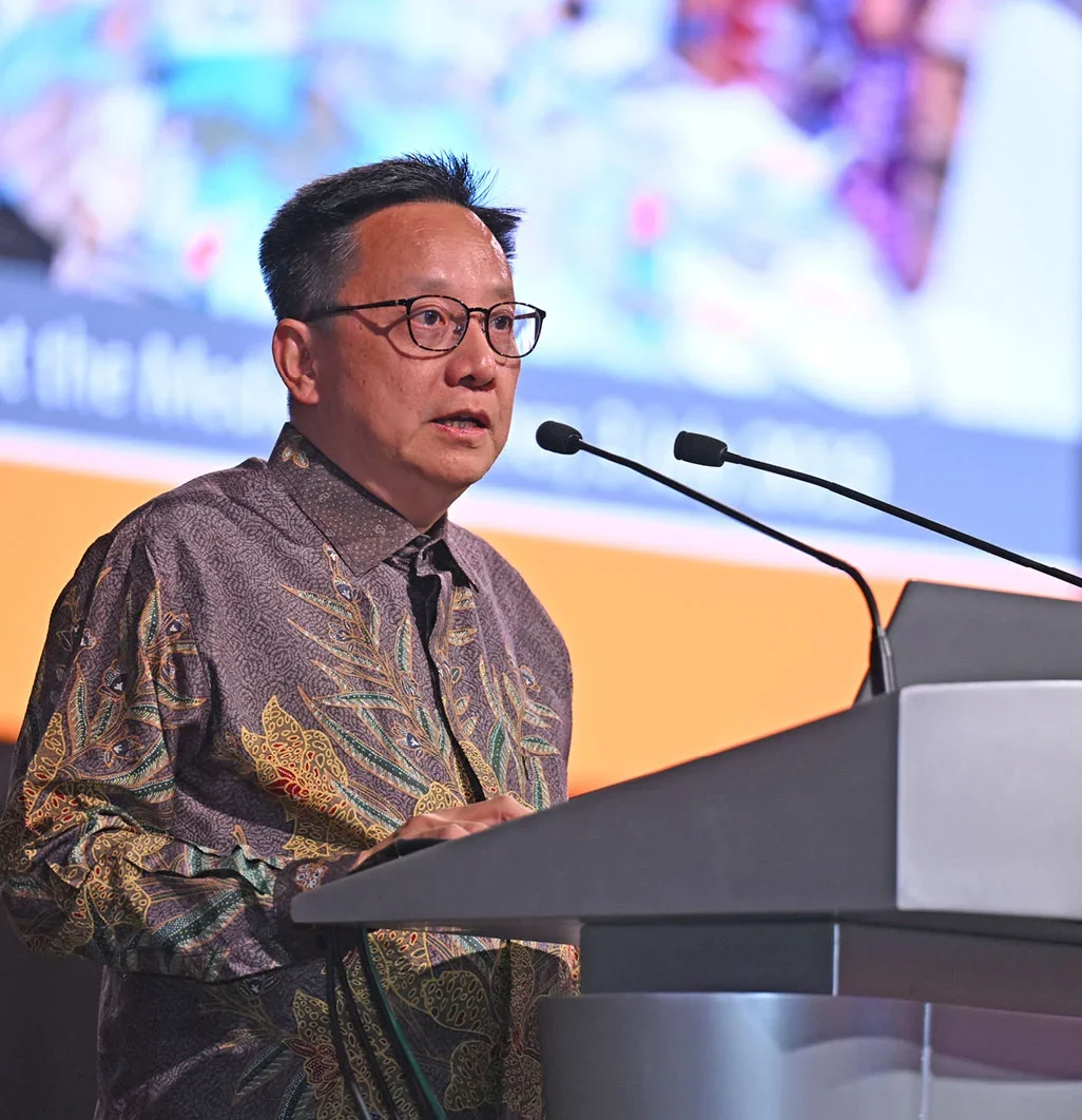 NUS Medicine Dean Prof Chong Yap Seng speaking from the podium.