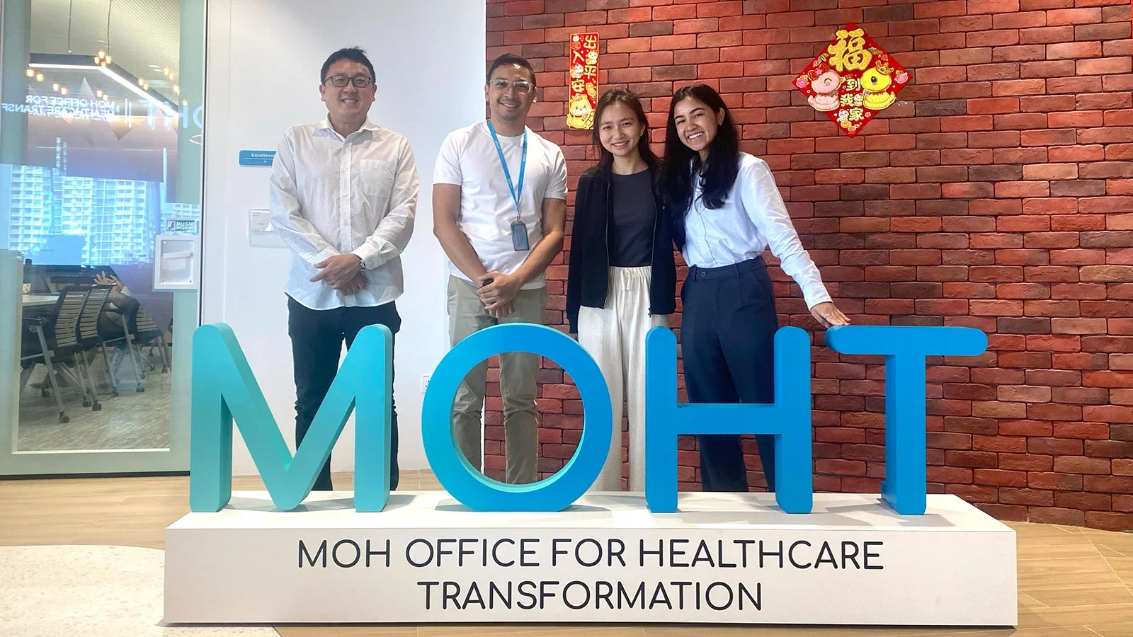 Nerissa Ng (third from left) and Eliora Joseph (right) with their supervisors from the MOH Office for Healthcare Transformation.