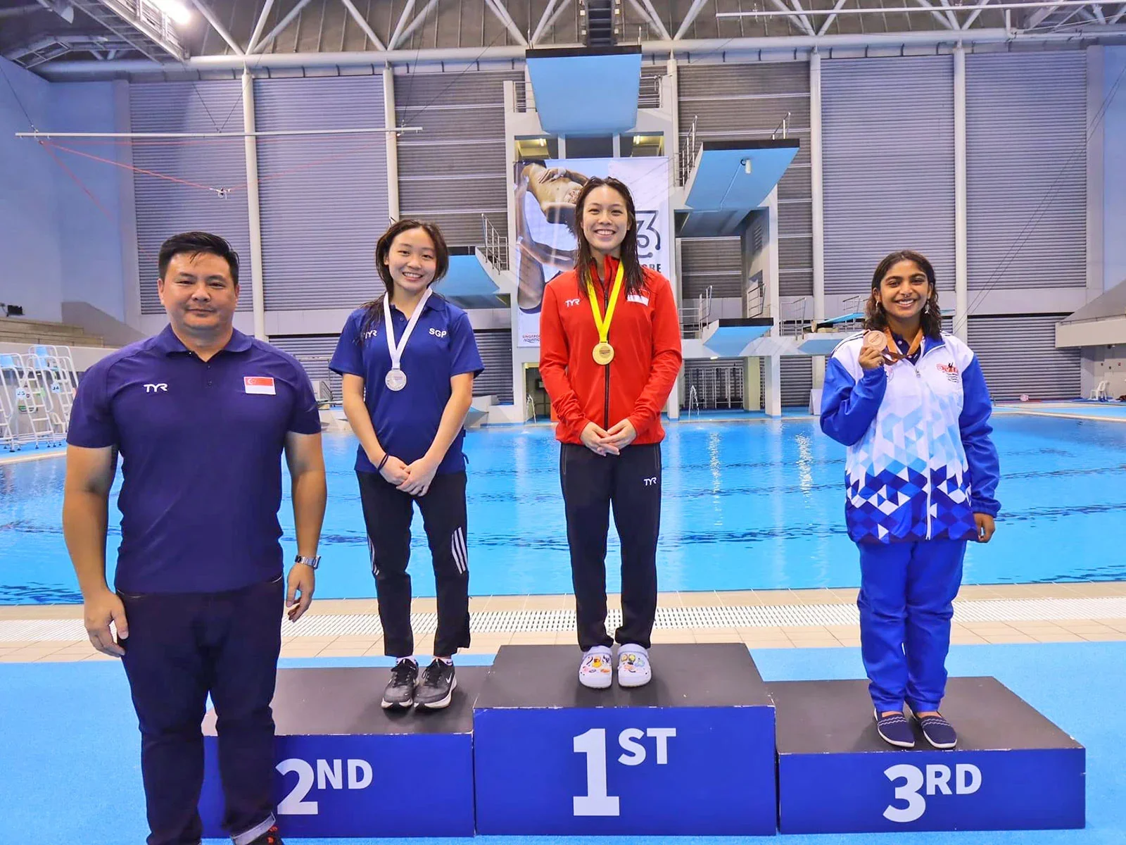 Ashlee (middle) at the 13th Singapore National Diving Championships 2024 OCBC Aquatic Centre, winning the Women’s 3m Springboard.