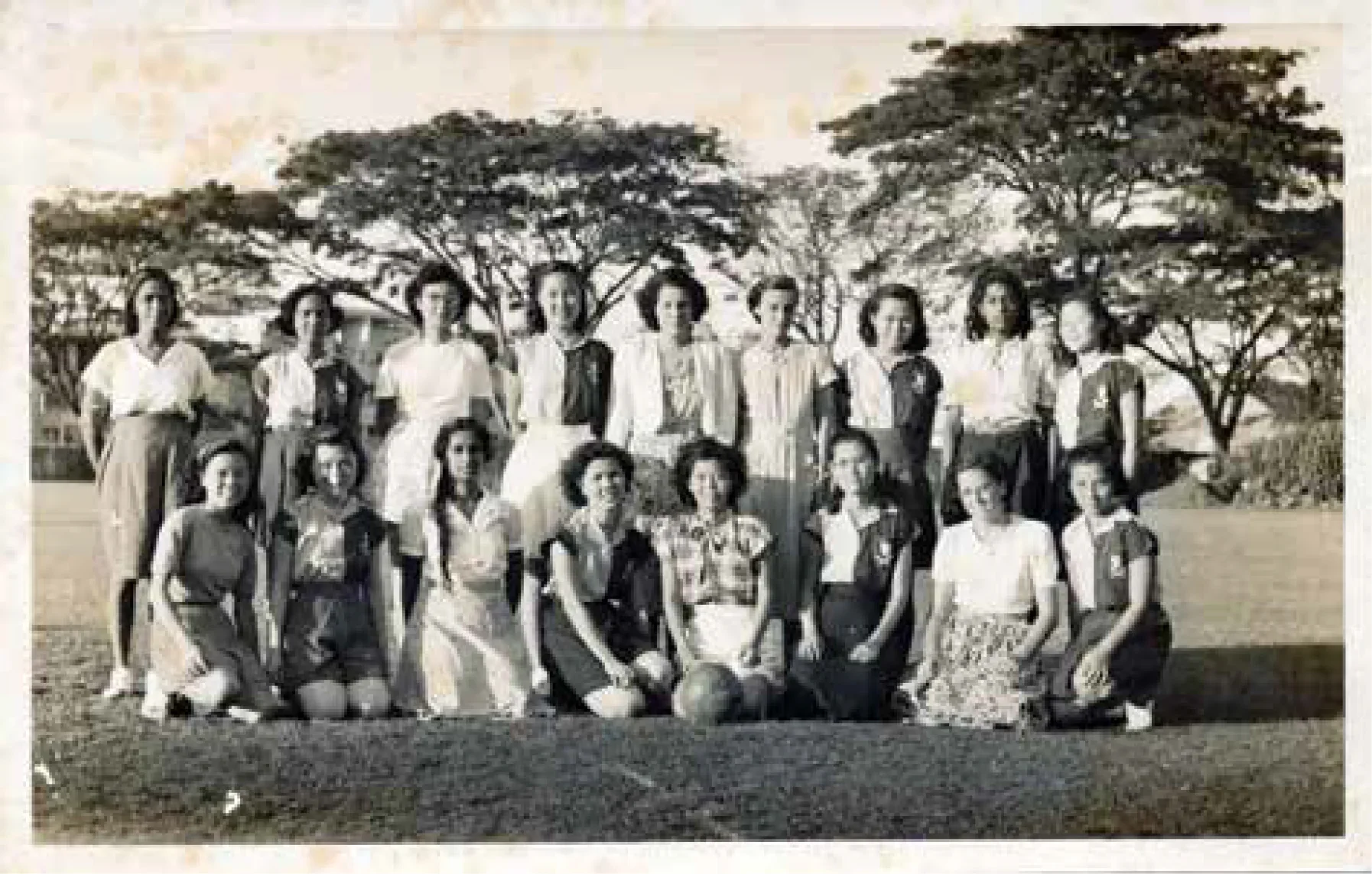 Monochromatic photo. Medical netball team posing for a group photo.