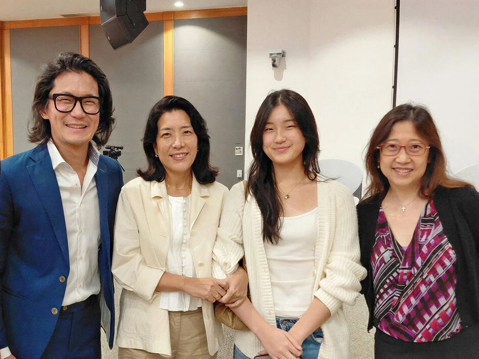 (From left) Prof Chang with his wife and daughter, a current NUS student, and Assoc Prof Yvonne Tay, who chaired the session.